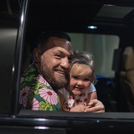 Croia McGregor with her father in one of Conor McGregor's lavish car.